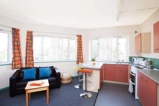 Sofa kitchen bar stools and countertops living kitchen at Arrad House in Liverpool Student Accommodation
