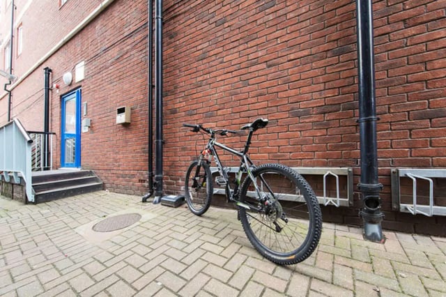 Mountain bike parked by brick building exterior at Arrad House in Liverpool Student Accommodation