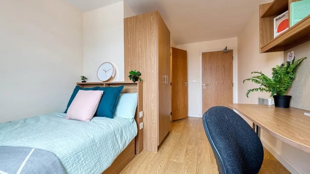 Bed closet and desk student bedroom at Collegiate Athena Hall in Ipswich Student Accommodation