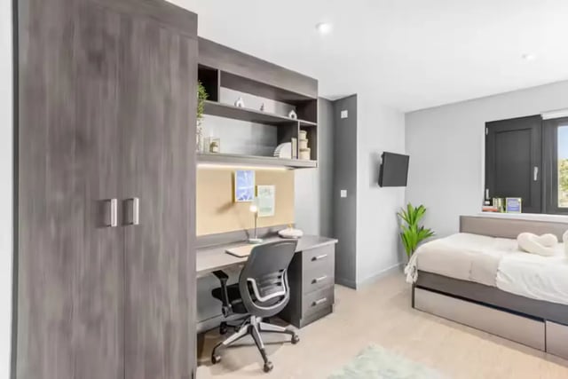 Wardrobe desk chair bed and television bedroom at Windsor House in Cardiff Student Accommodation