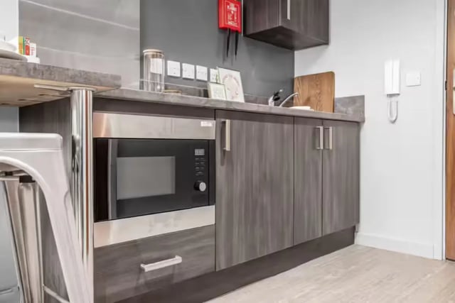 Microwave and cabinets in student kitchen kitchen at Windsor House in Cardiff Student Accommodation