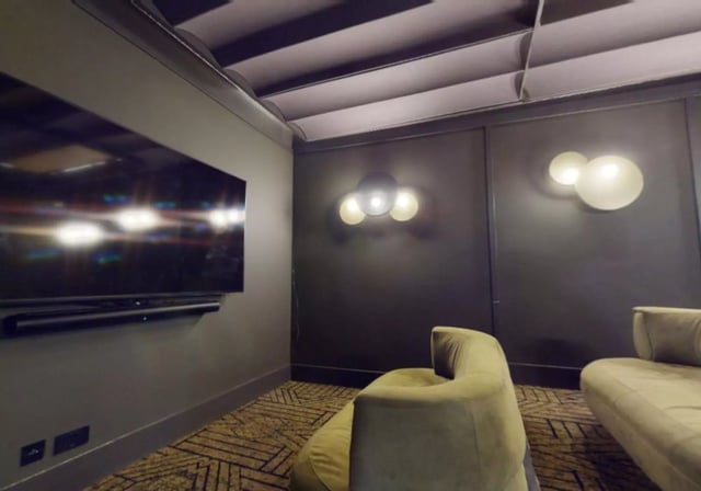 Modern living room with TV and sofas living room at iQ Aldgate in London Student Accommodation