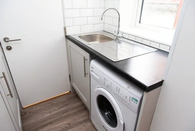 Washing machine sink and door Utility room at 18 Cauldon Road in Stoke-On-Trent Student Accommodation