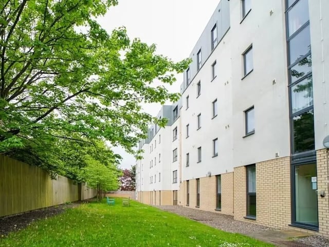 Building exterior green lawn and two benches exterior at Beaverbank Place in Edinburgh Student Accommodation