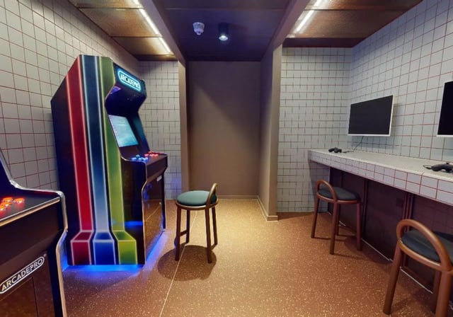 Arcade machines and computer stations gaming area at iQ City in London Student Accommodation