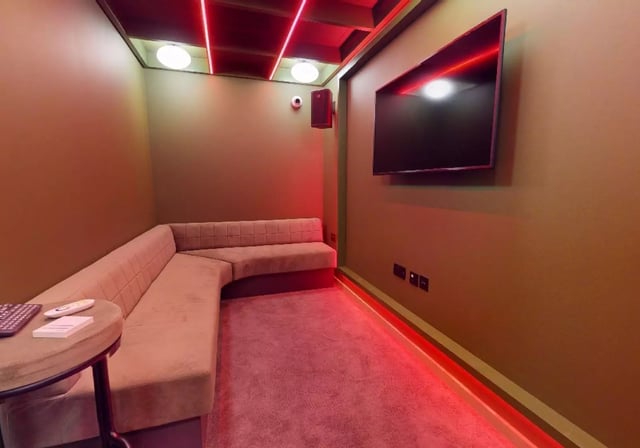 L shaped sofa TV and speaker entertainment area at iQ City in London Student Accommodation