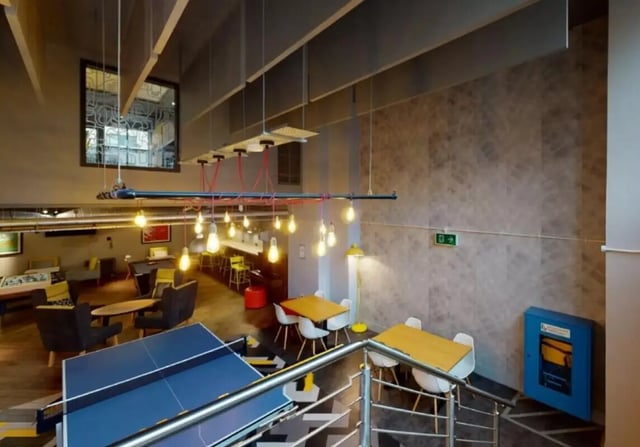 Ping pong table seating area with tables living area at iQ Marsden House in Leeds Student Accommodation