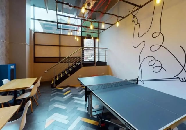 Ping pong table stairs and tables common area at iQ Marsden House in Leeds Student Accommodation