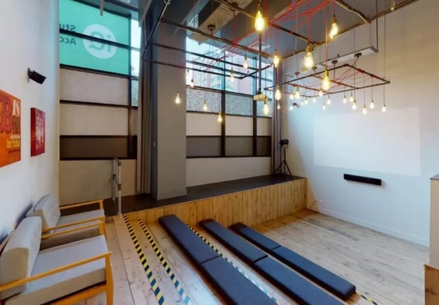 Projector stage benches and seating lounge area at iQ Marsden House in Leeds Student Accommodation