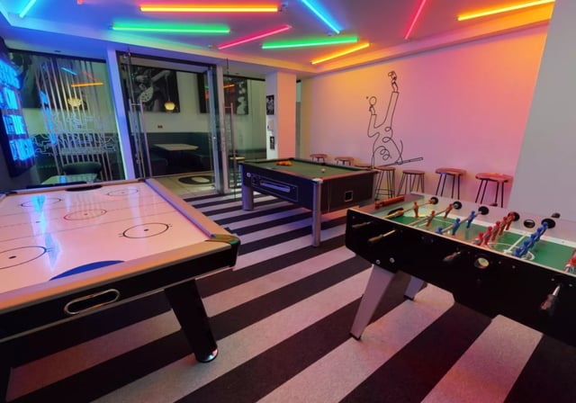 Air hockey pool and foosball tables playing area at iQ Hammersmith in London Student Accommodation