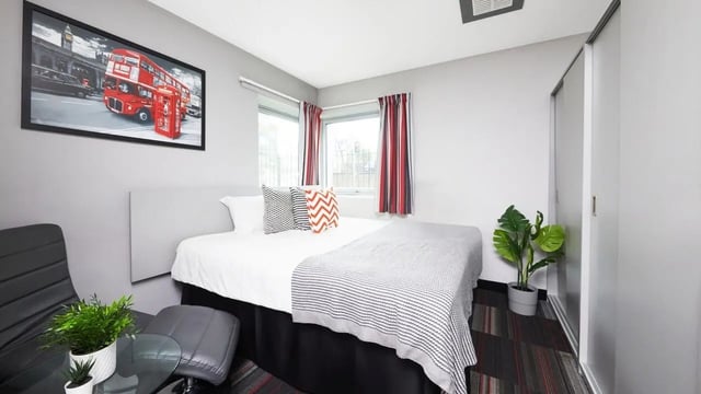 Bed with London art plant and chair bedroom at Clarendon Street in Nottingham Student Accommodation