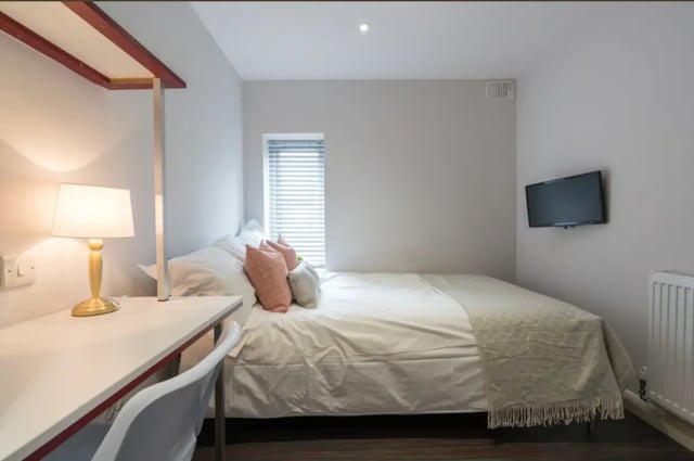 Bed desk lamp television and radiator bedroom at 41 Seaford Street in Stoke-On-Trent Student Accommodation