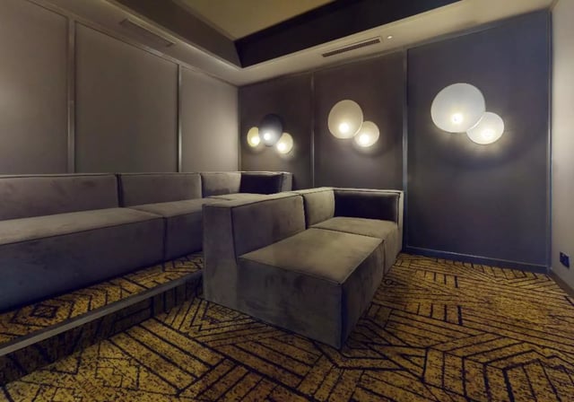 Modern modular couches with patterned carpet living room at iQ Highbury in London Student Accommodation