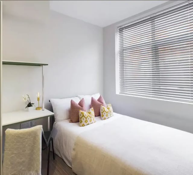 Bed with pillows desk and chair bedroom at 48 Ashford Street in Stoke-On-Trent Student Accommodation