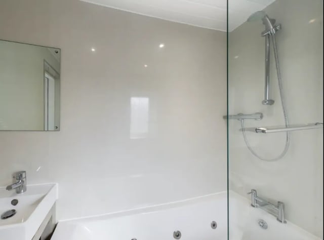 Sink mirror shower and bathtub bathroom at 48 Ashford Street in Stoke-On-Trent Student Accommodation