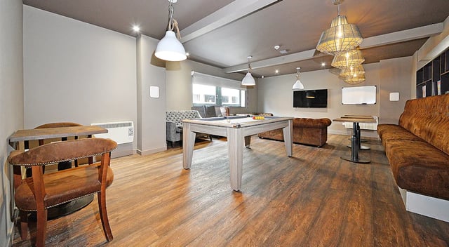 Pool table sofa and chairs living room at Marketgait Apartments in Dundee Student Accommodation