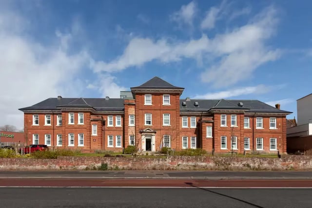 Red brick building with multiple windows exterior at Atlas House in Exeter Student Accommodation