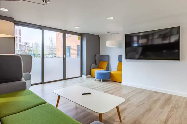 Sofa TV chairs and table Living room at Atlas House in Exeter Student Accommodation