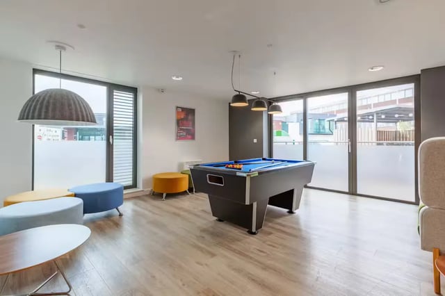 Pool table colorful ottomans large windows communal area at Atlas House in Exeter Student Accommodation
