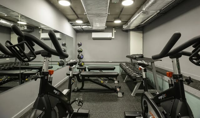 Spinning bikes weights benches gym equipment gym at St Peter's Hall in Bournemouth Student Accommodation