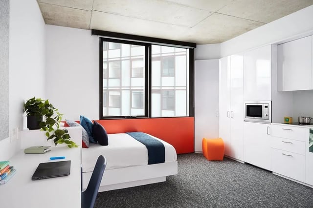 Bed desk plant microwave cabinets student studio at Scape Toowong in Brisbane Student Accommodation