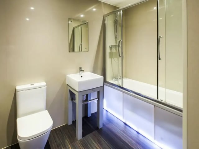 Toilet sink bathtub with shower modern bathroom at 23 Carlton Road in Stoke-On-Trent Student Accommodation