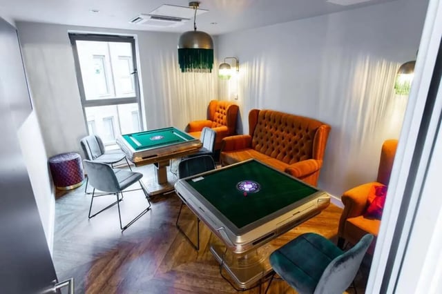 Two mahjong tables velvet chairs lounge area at Steel City in Sheffield Student Accommodation
