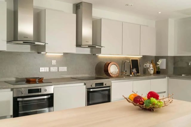 Modern white kitchen with ovens and fruit bowl kitchen at Steel City in Sheffield Student Accommodation