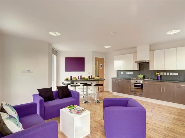 Purple sofas dining bar and kitchen living area at Davidson House in Kingston Upon Thames Student Accommodation