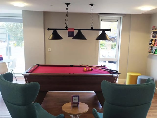 Pool table with cues and balls playing area at Davidson House in Kingston Upon Thames Student Accommodation