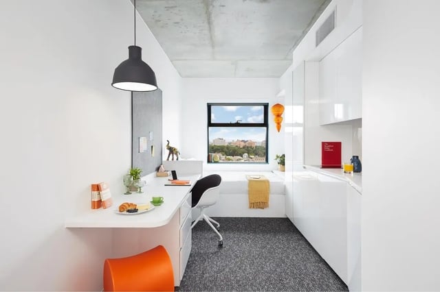 Desk bed and kitchen area Studio room at Scape Carlton in Melbourne Student Accommodation