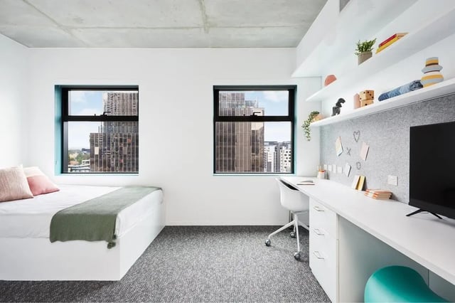 Bed desk chair and TV Bedroom at Scape Carlton in Melbourne Student Accommodation