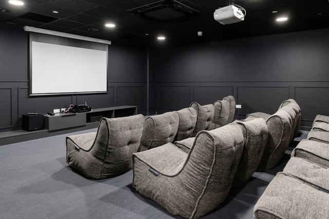 Comfortable beanbag chairs facing movie screen playing area at Stanley Studios in Southampton Student Accommodation