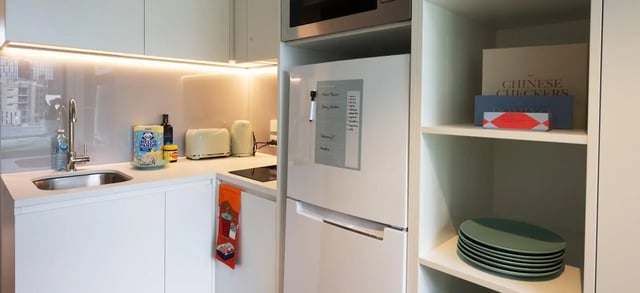 Sink toaster kettle fridge and shelves kitchen at Scape Leicester in Melbourne Student Accommodation