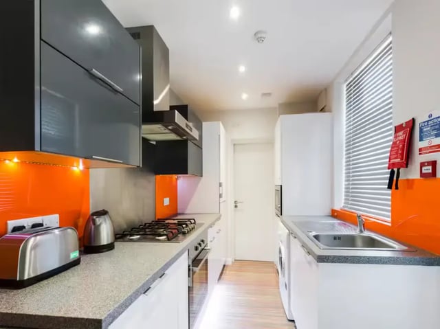 Toaster kettle hob sink washing machine kitchen at 85 Seaford Street in Stoke-On-Trent Student Accommodation