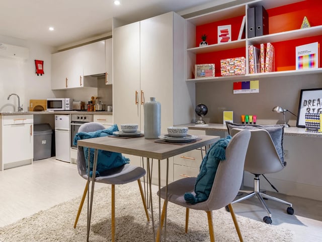 Kitchen dining and study areas in a studio. at The Lantern in Liverpool Student Accommodation