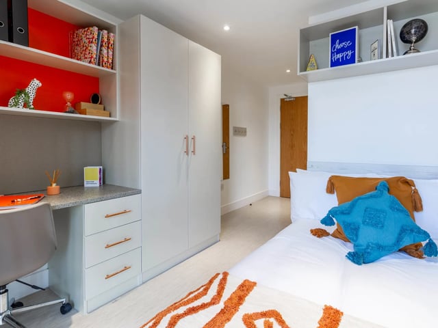 Bed desk wardrobe and shelves bedroom interior at The Lantern in Liverpool Student Accommodation