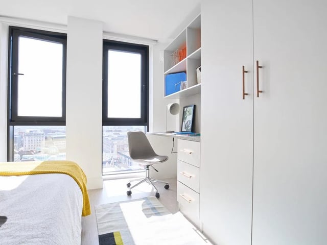 Bed white blanket desk chair shelves wardrobe bedroom at The Lantern in Liverpool Student Accommodation