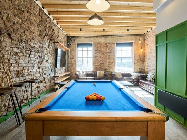 Pool table sofas television and stools communal area at The Lantern in Liverpool Student Accommodation