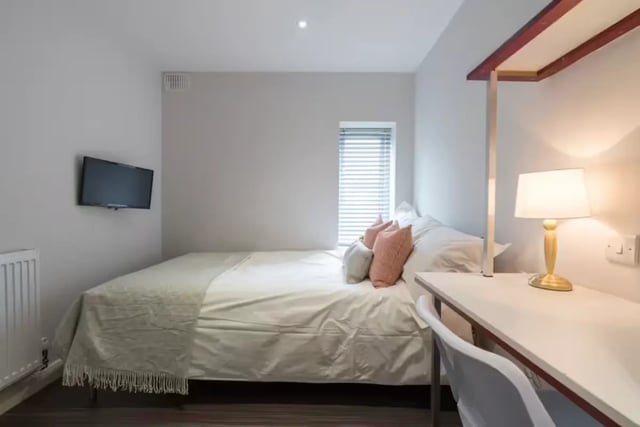 Bed desk lamp television and blinds bedroom at 85 Seaford Street in Stoke-On-Trent Student Accommodation