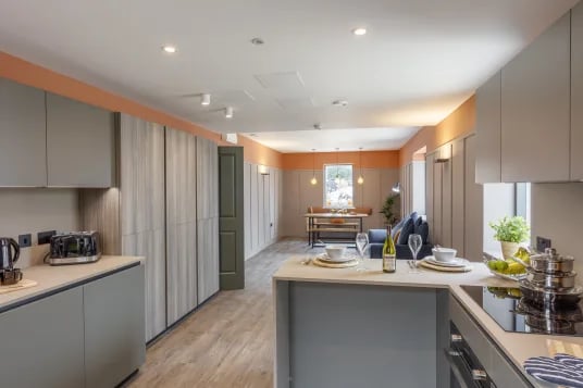 Kitchen with dining area and sofa living room at The Garage Egham in Egham Student Accommodation