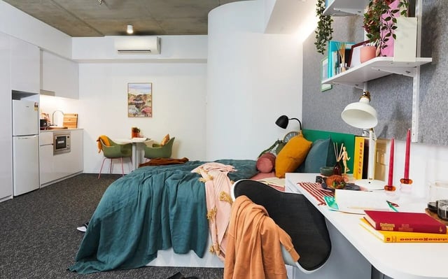 Bed kitchen table chairs and desk bedroom at Scape Darlington in Sydney Student Accommodation