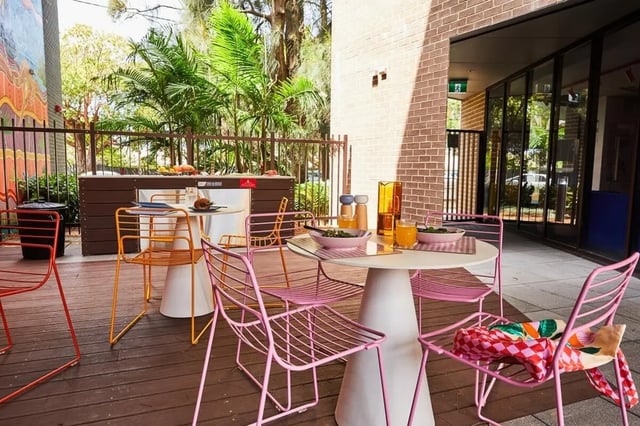 Outdoor seating with tables and chairs patio at Scape Darlington in Sydney Student Accommodation