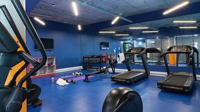 Treadmills and weights in modern gym Playing Area at Scape Darlington in Sydney Student Accommodation