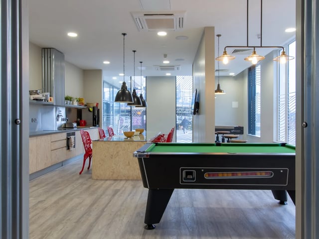 Pool table kitchen dining area common room at The Barn in Exeter Student Accommodation