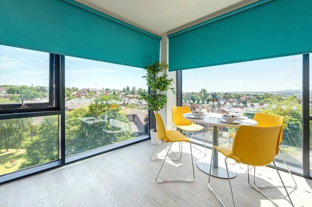 Dining table with yellow chairs and plant dining area at Central Living in Exeter Student Accommodation