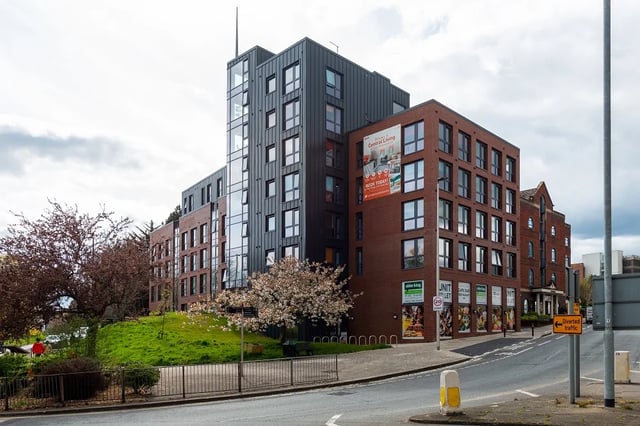 Modern brick building with glass exterior at Central Living in Exeter Student Accommodation