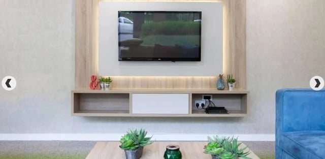 Wall mounted television with shelving living room at Denmark Road in Manchester Student Accommodation