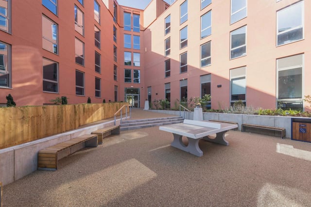 Ping pong table benches and building exterior at Pershore Junction in Birmingham Student Accommodation