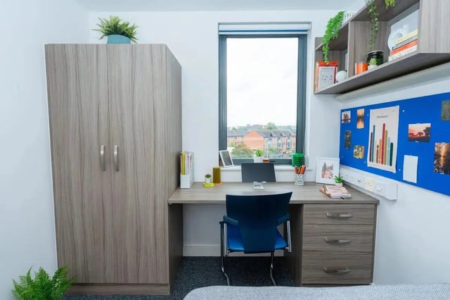 Wardrobe desk chair and bulletin board study area at Grafton Street in Manchester Student Accommodation